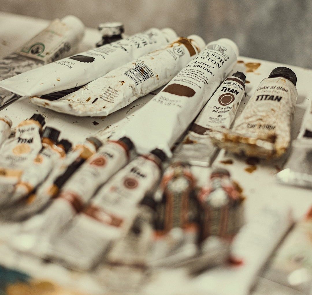 a pile of newspapers sitting on top of a table