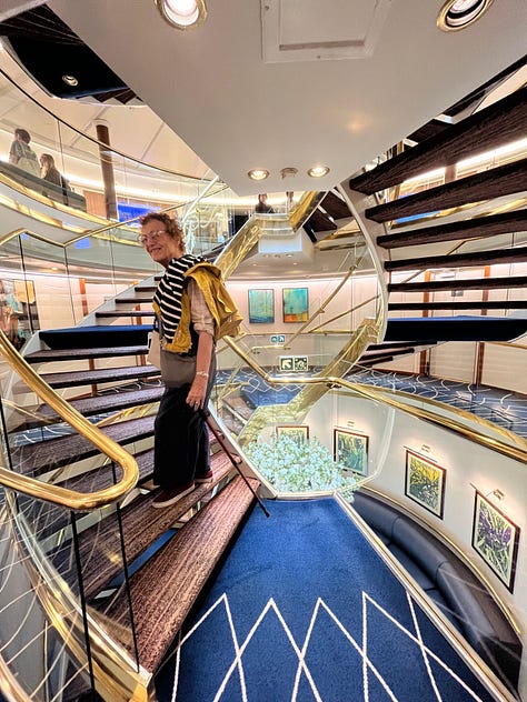 A group of nearly 40 food writers on the staircase; writer, artist, muse Elizabeth Luard on a golden double-helix staircase; Bruce pointing out the Star Legend