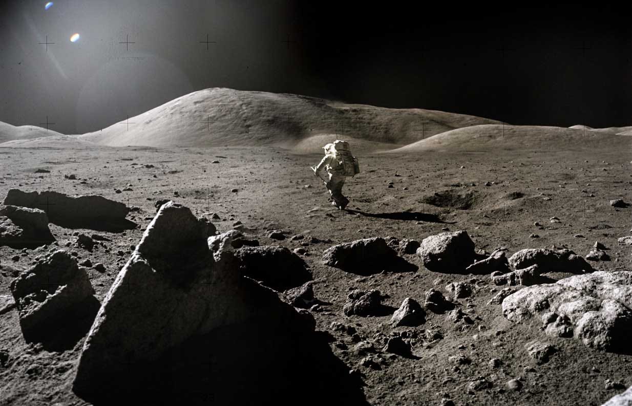 grey moon landscape with an astronaut walking