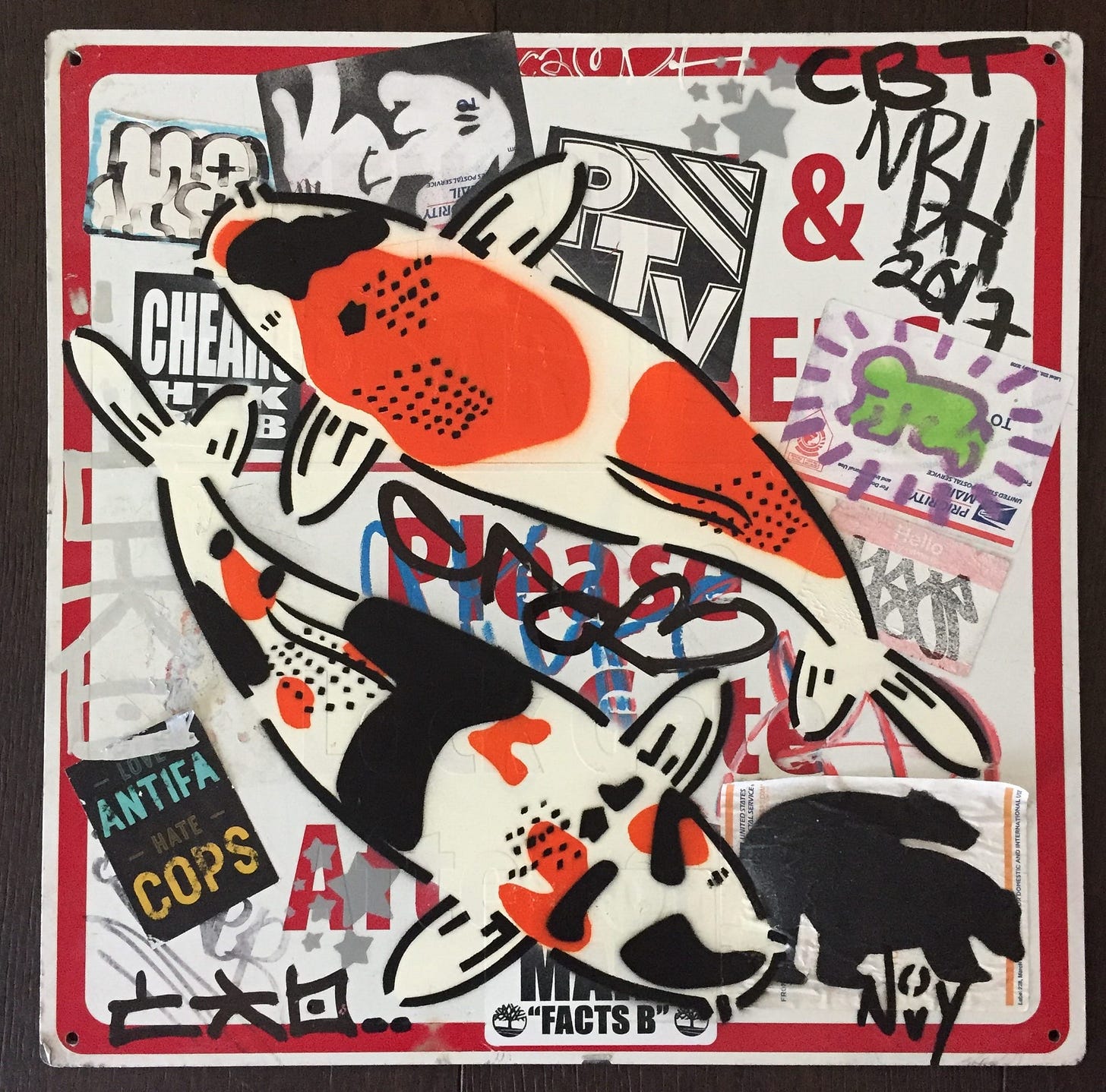 Street art collage featuring two koi fish with bold black, orange, and white colors. Background includes stickers and graffiti with text and abstract designs. Tone is vibrant and urban. Jeremy's tag/signature is in the bottom right corner, Novy. Street art collage featuring two koi fish with bold black, orange, and white colors. Background includes stickers and graffiti with text and abstract designs. Tone is vibrant and urban. Jeremy's tag/signature is in the bottom right corner, Novy.