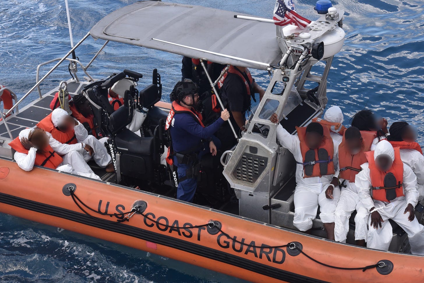 A Coast Guard Law Enforcement Detachment takes custody of migrants attempting to illegally reach the US by sea.
