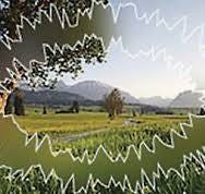 A green field with trees and mountains in the background

AI-generated content may be incorrect.