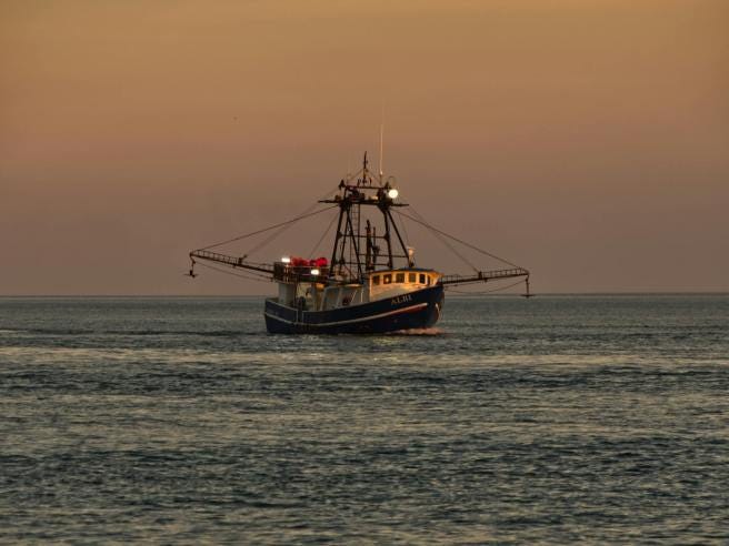 a fishing boat on the sea sea