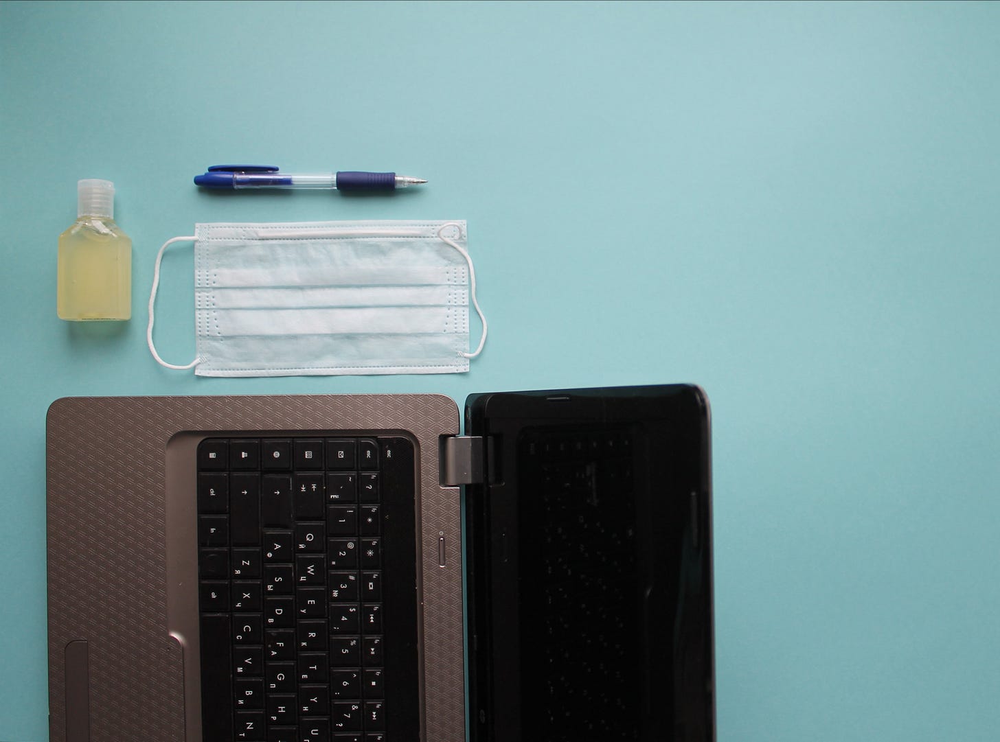 laptop, mask, pen, and hand sanitizer laptop, mask, pen, and hand sanitizer