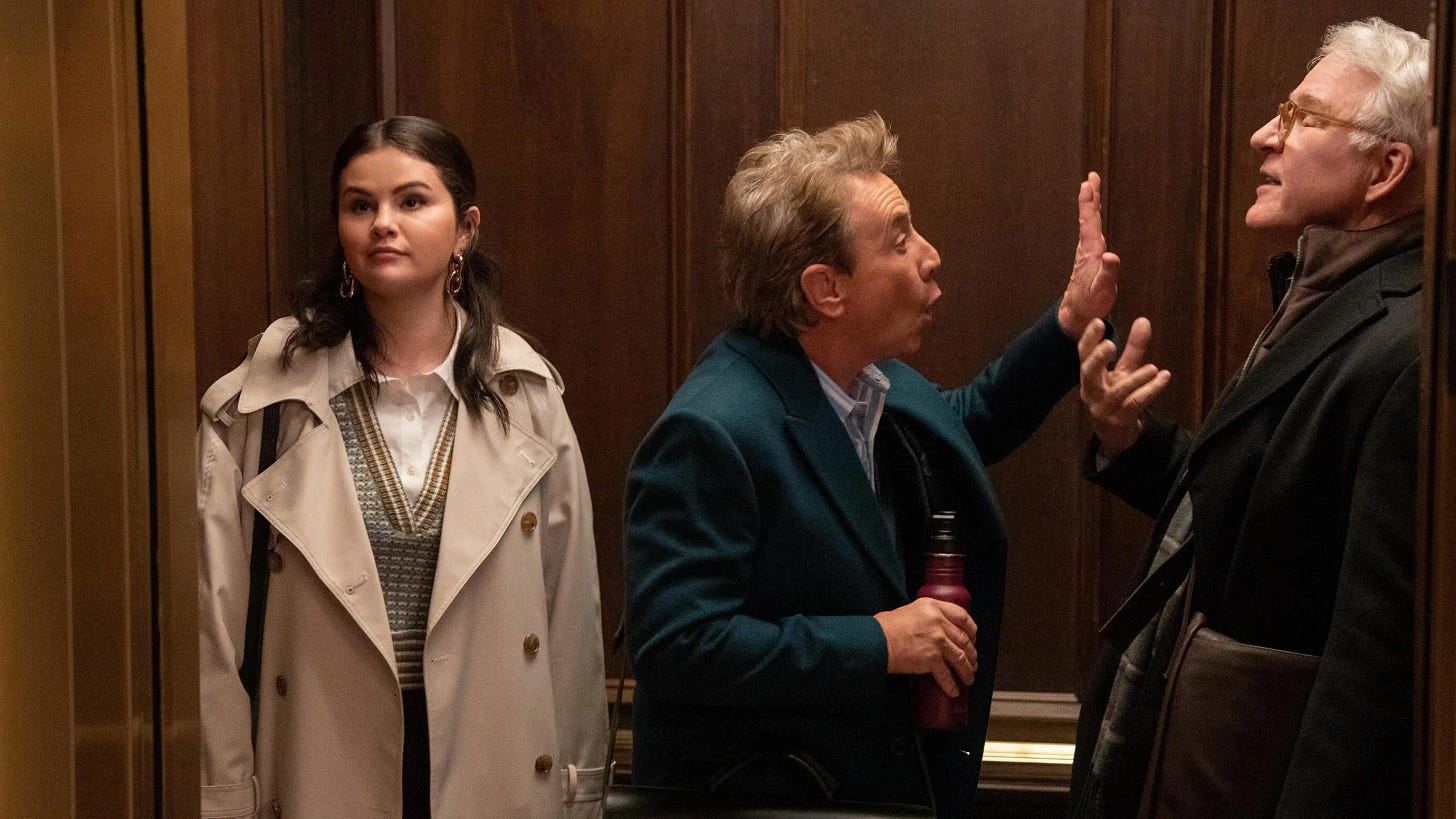 selena gomez, martin short, and steve martin in an elevator
