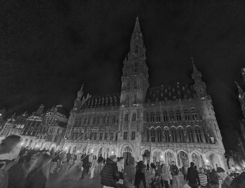 Main square Bussels lit up in purple from Never Lost Letters by Stuart Found
