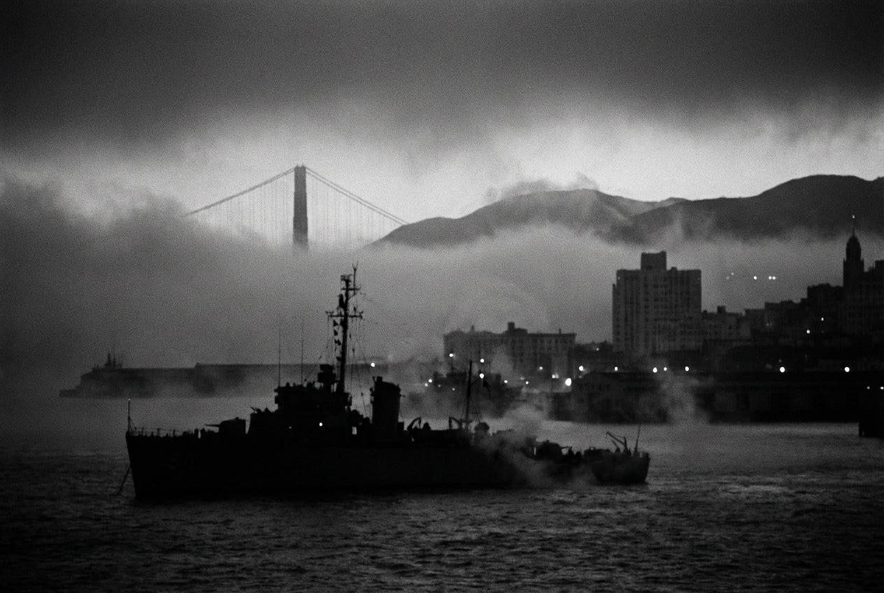 Black and white photograph of San Francisco Bay in 1950 during Operation Sea-Spray. A dark silhouette of a Navy minesweeper sits in the foreground as fog and mist rise from the water around it. The Golden Gate Bridge emerges through heavy clouds in the background, partially obscured. The San Francisco waterfront glows with scattered lights along the hillside. The atmospheric noir image captures the night the military secretly sprayed bacteria over 800,000 unsuspecting residents.