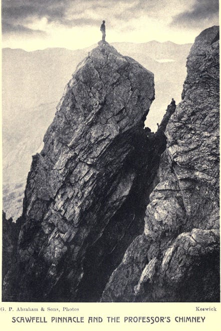 man stands on rock tower