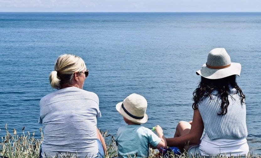 women and child near ocean women and child near ocean
