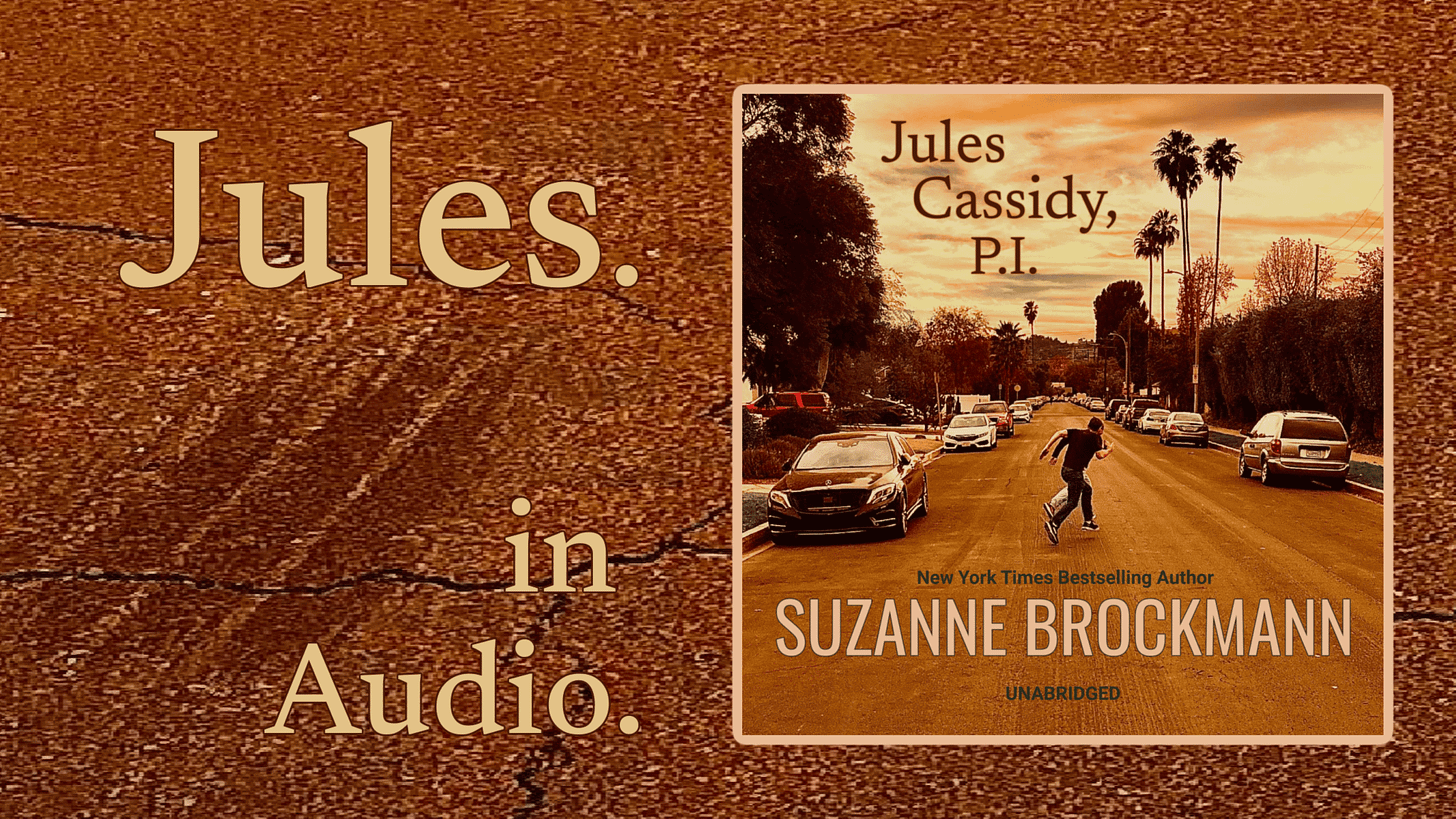 The square audiobook cover for Jules Cassidy, P.I. by New York Times Bestselling Author Suzanne Brockmann features the main art from the book’s cover, with a reddish-tinged evening sky and a tire-mark-streaked road in a tired-looking Los Angeles Valley neighborhood. The small figures of two men, one large, one smaller, run across the car-lined street. Palm trees and electrical poles are silhouette against the sunset.
