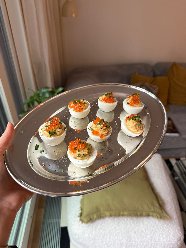 caramelized onion deviled eggs with salmon roe and chives