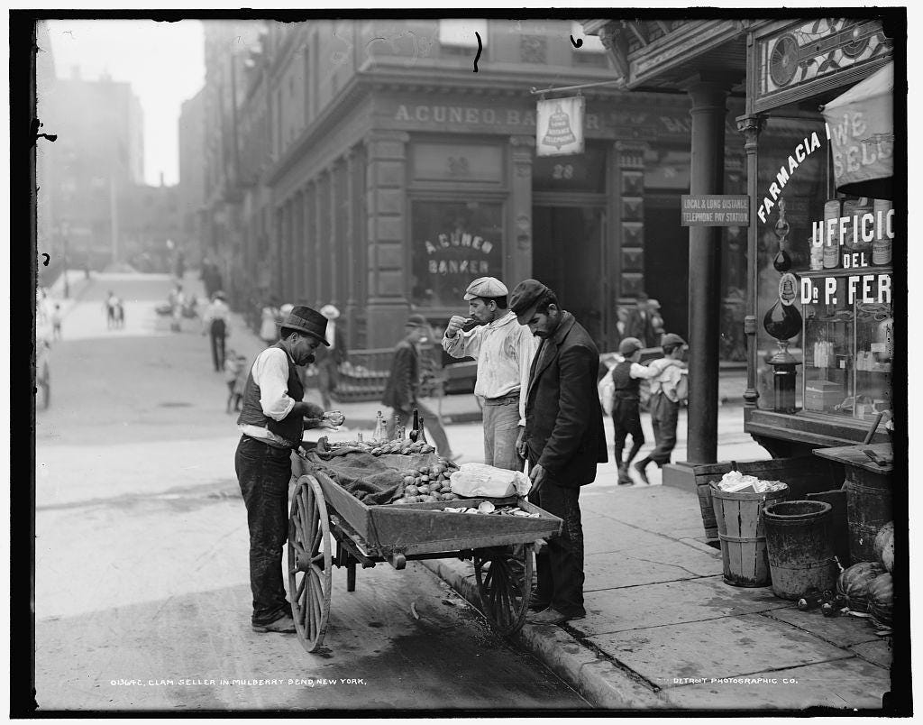 A glimpse into early 20th-century New York: a clam seller in Mulberry Bend, N.Y. (then 'Little Italy'), circa 1900.