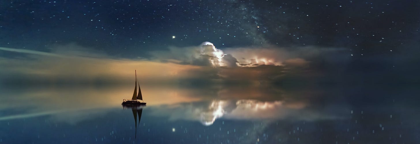 A ship sailing into the great beyond with clouds and reflections A ship sailing into the great beyond with clouds and reflections