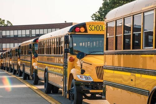 School buses lined up ready to pick up kids yellow buses lined up in front of school ready for first day public schools stock pictures, royalty-free photos & images School buses lined up ready to pick up kids yellow buses lined up in front of school ready for first day public schools stock pictures, royalty-free photos & images