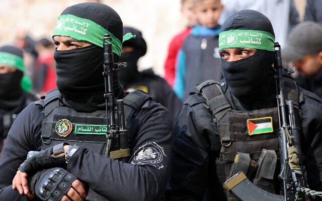 Members of the Izz ad-Din al-Qassam Brigades, the Hamas terror group's military wing, attend the funeral of two fighters in Gaza City on January 24, 2025. (Omar al-Qattaa/AFP) Members of the Izz ad-Din al-Qassam Brigades, the Hamas terror group's military wing, attend the funeral of two fighters in Gaza City on January 24, 2025. (Omar al-Qattaa/AFP)