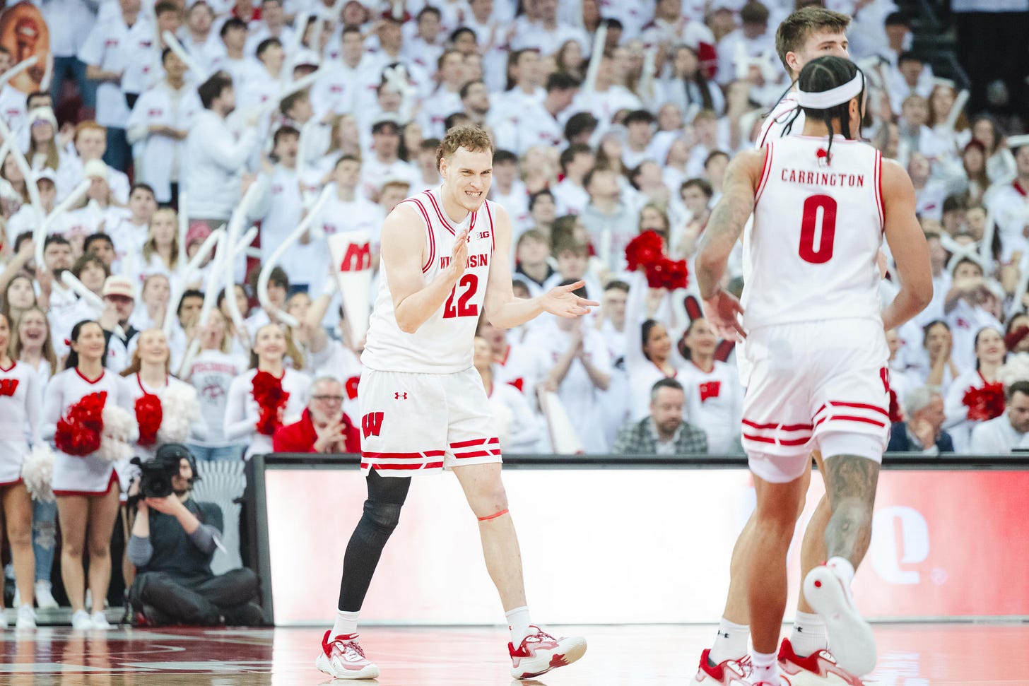 austin rapp claps his hands in a white uniform