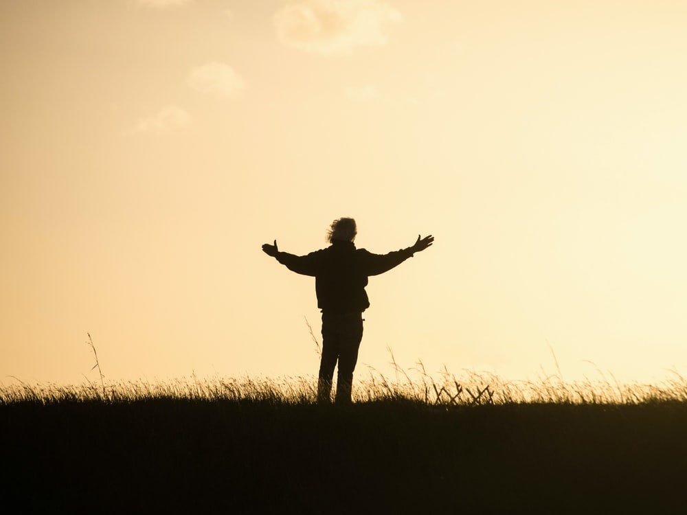 silhouette of person spreading hands silhouette of person spreading hands