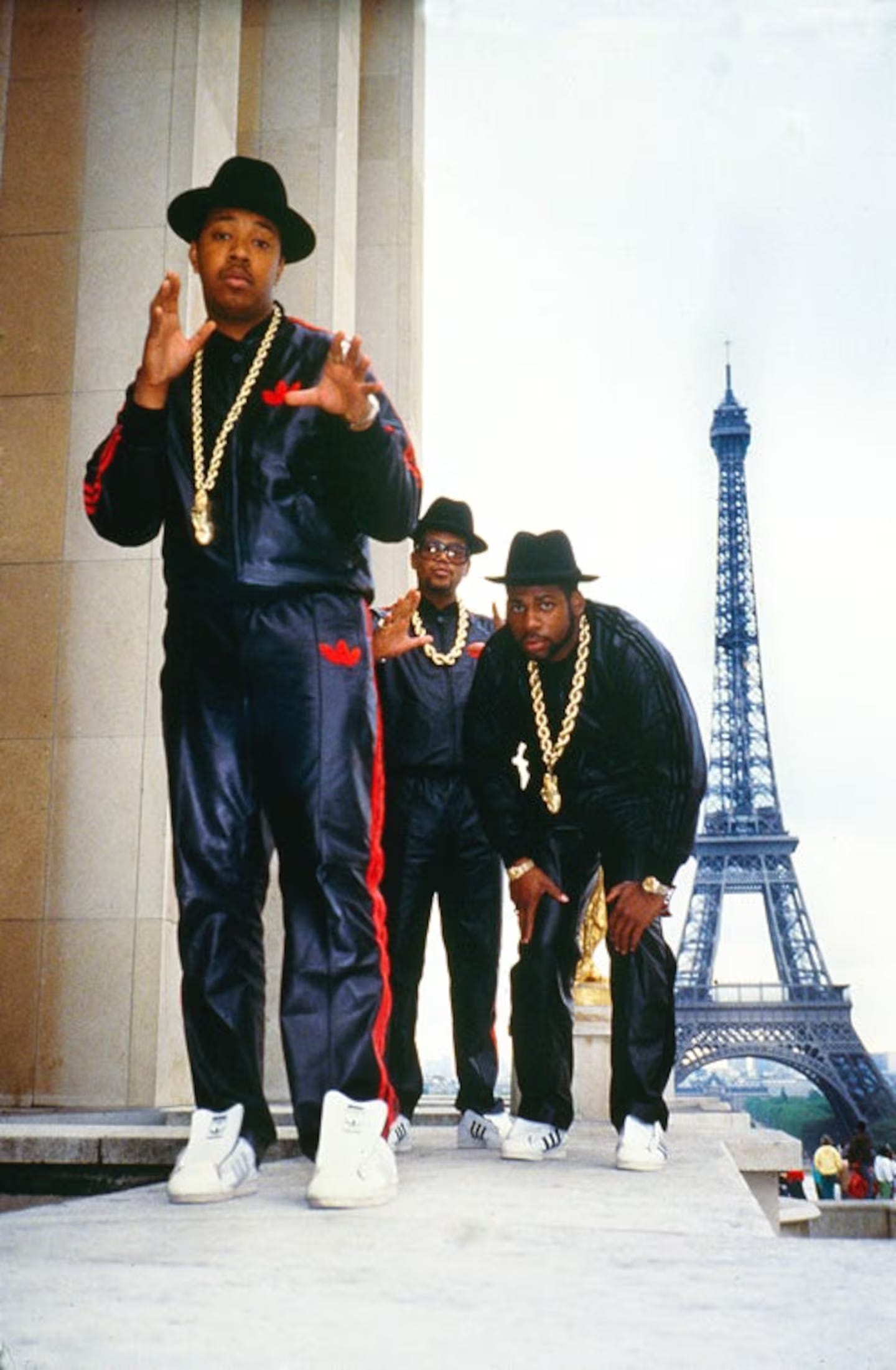 RUN DMC Posing in tracksuits and gold chains in front of the Eiffel Tower in 1987 photo by Ricky Powell