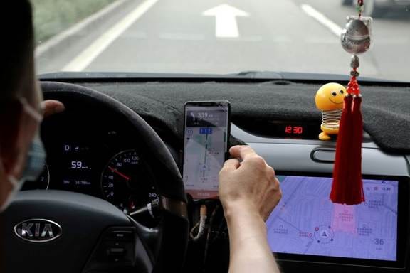 A picture containing car, person, device, control panel

Description automatically generated