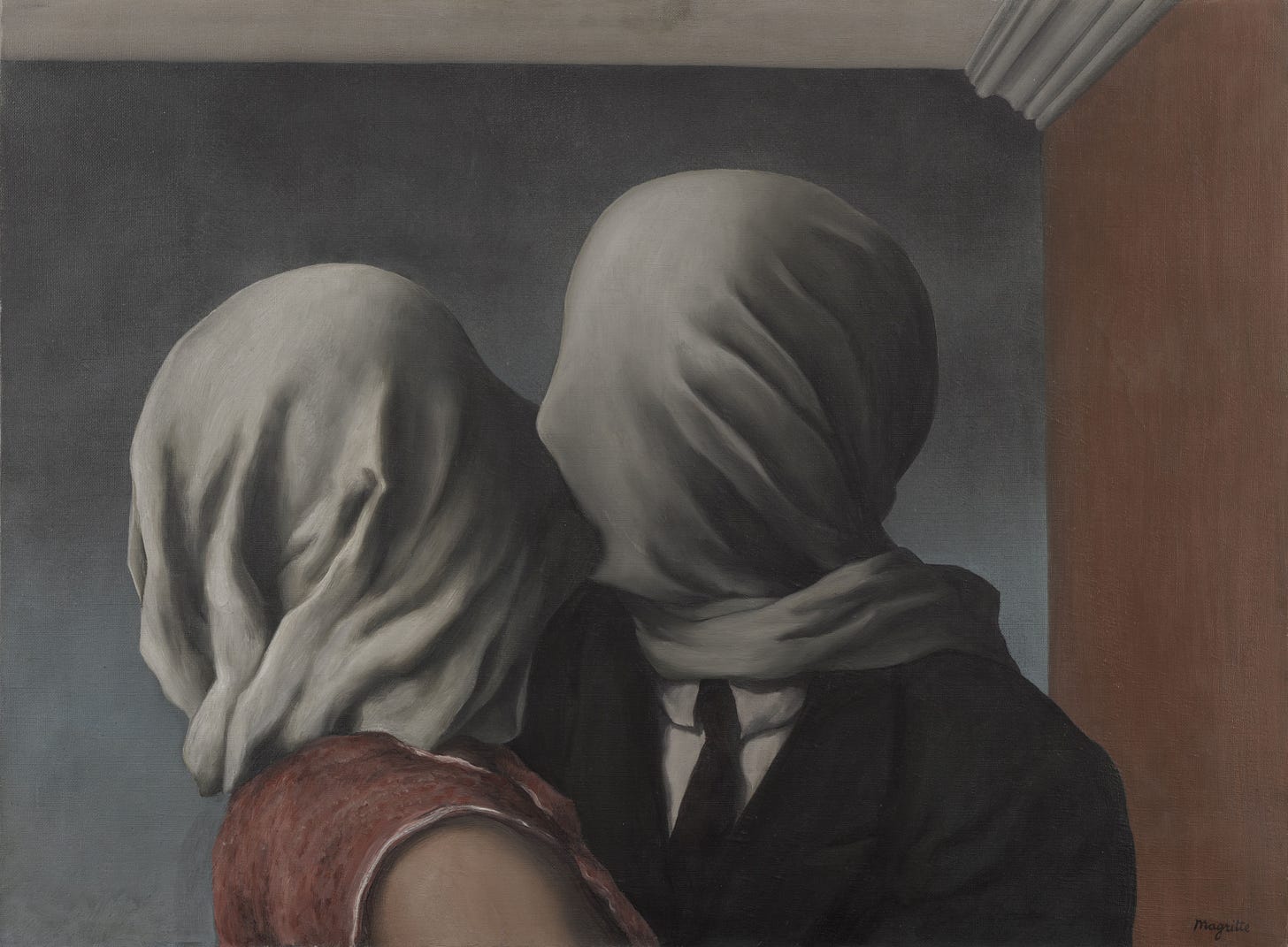 A couple kissing with white cloth over both heads A couple kissing with white cloth over both heads