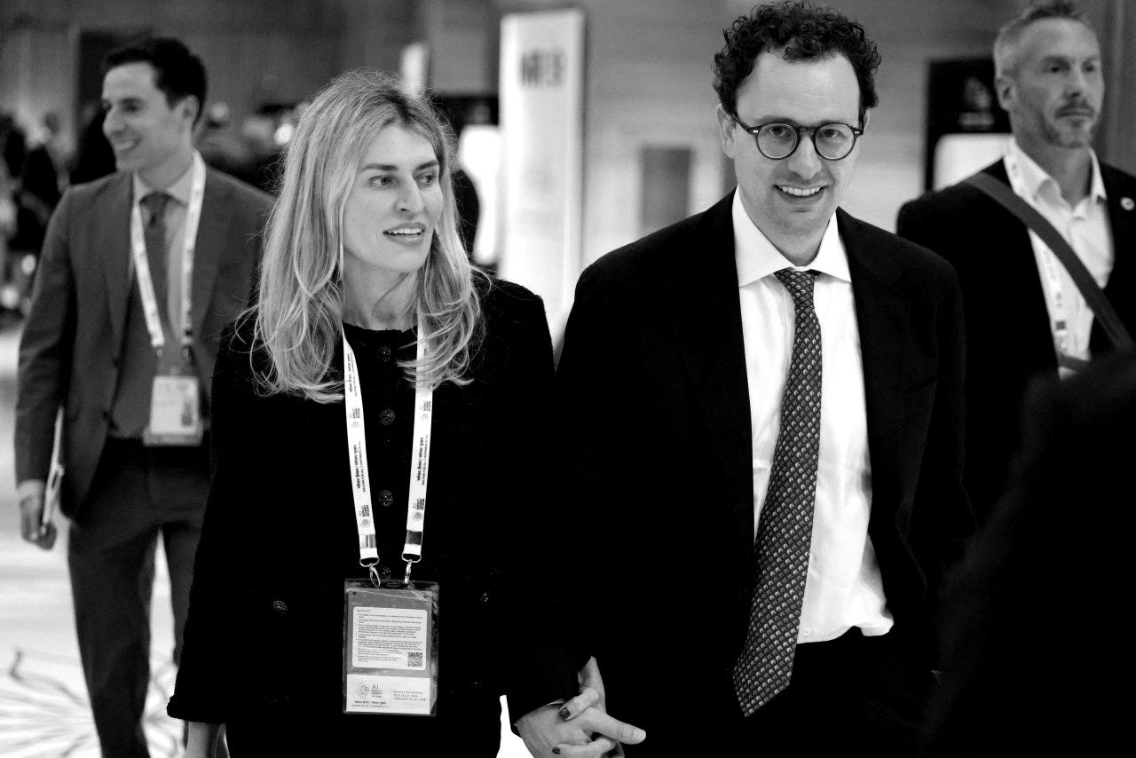 Cami Clark and Anthropic CEO Dario Amodei walking together at the AI Impact Summit.