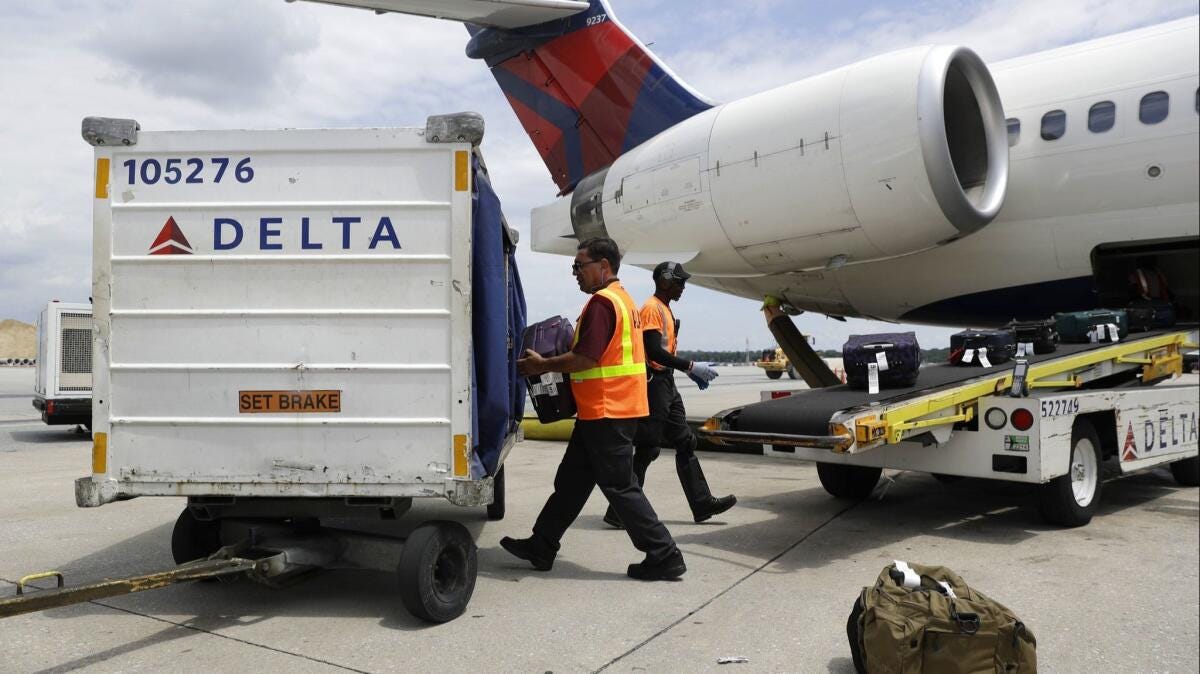 American and Delta match the higher bag fees charged by United and JetBlue  - Los Angeles Times