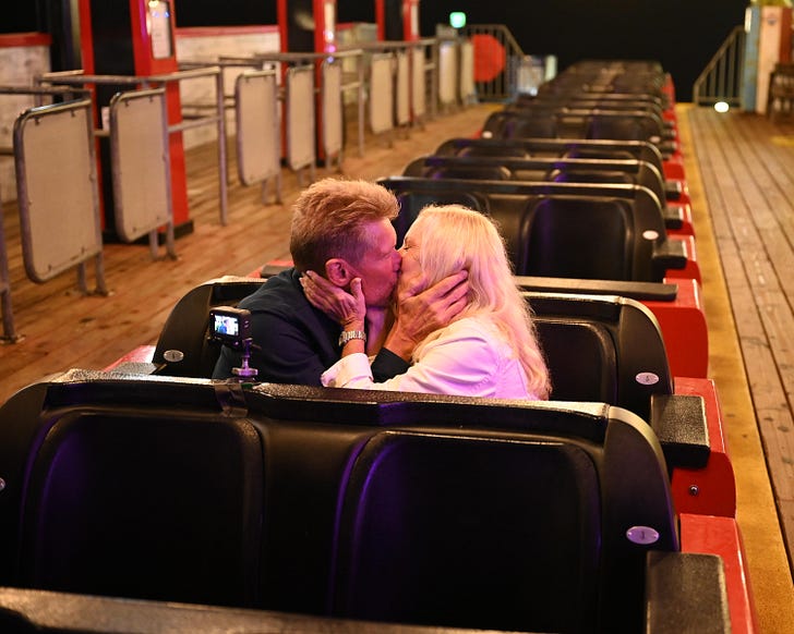Gerry and Ellen making out in the roller coaster