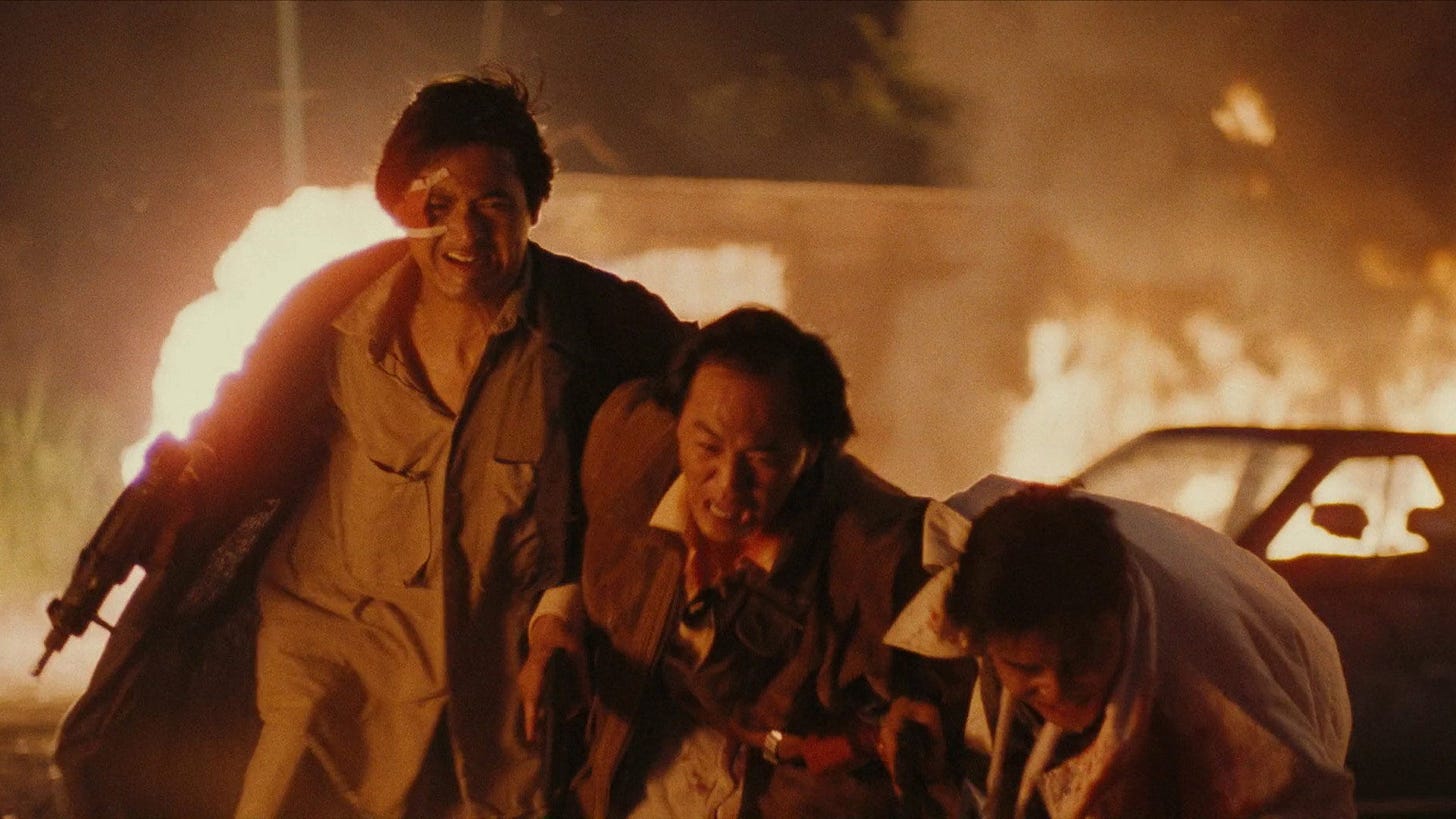 A Better Tomorrow | Still features a group of men running from an explosion.