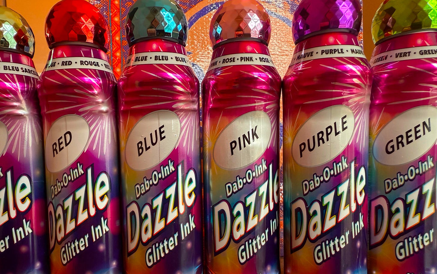 A row of glitter daubers in multiple colors