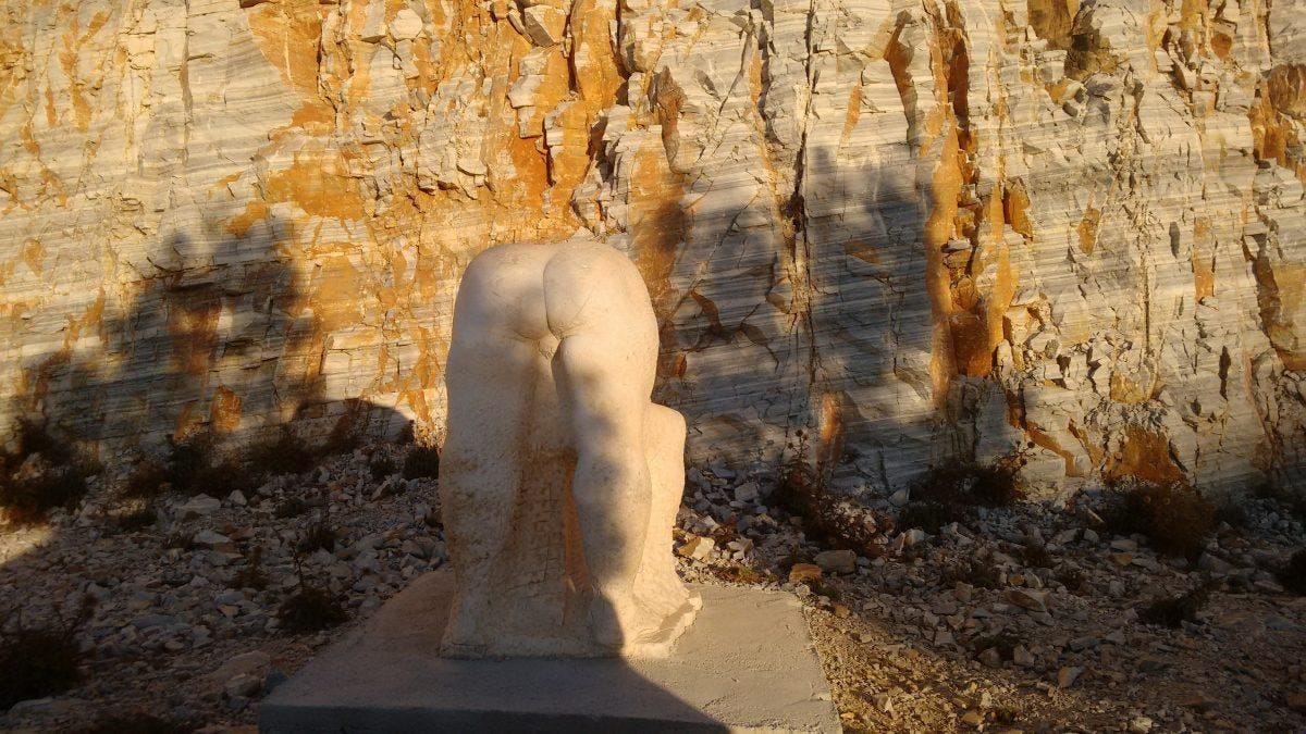 A mysterious sculpture by the roadside near Homer's Tomb in Ios.