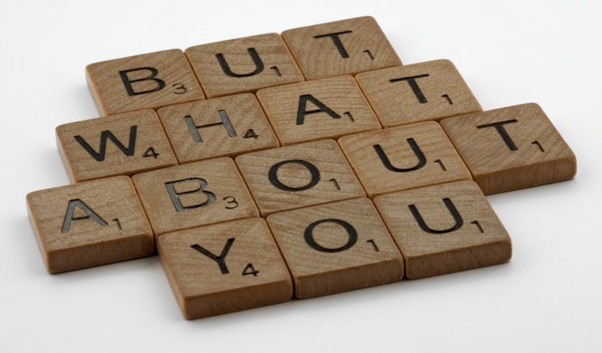 four scrabble tiles spelling out the words but what about you?