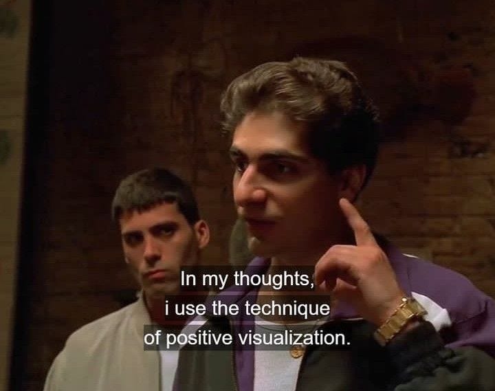 This may contain: two men standing next to each other in front of a brick wall with the words, in my thoughts i use the technique of positive visualization