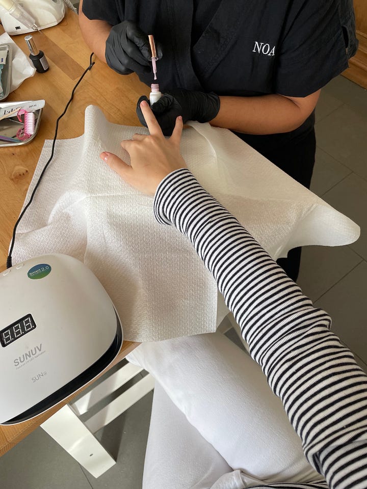 Manicure and pedicure at home with a baby
