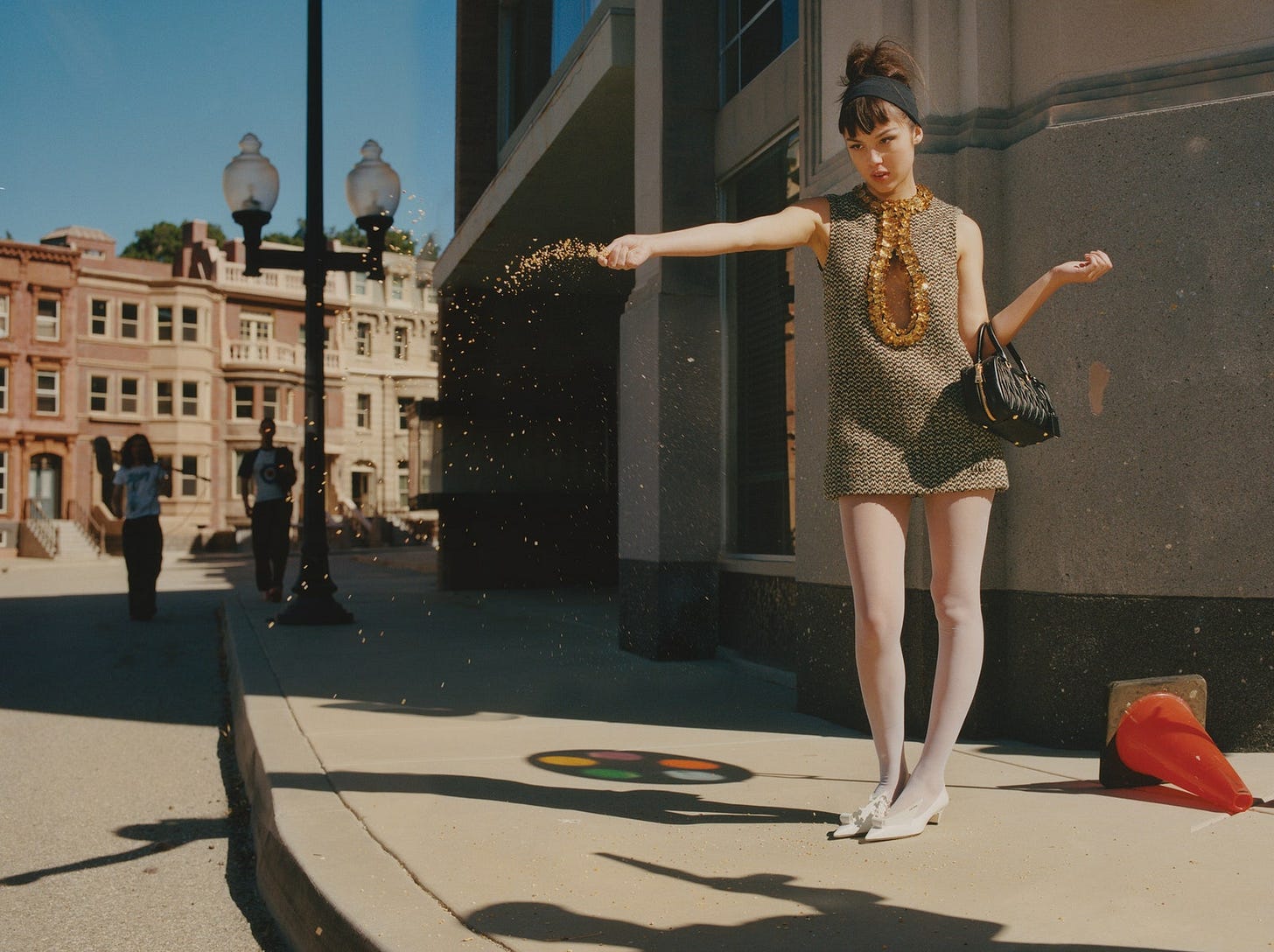 GOLD DUST Rodrigo wears a Miu Miu dress and bag.