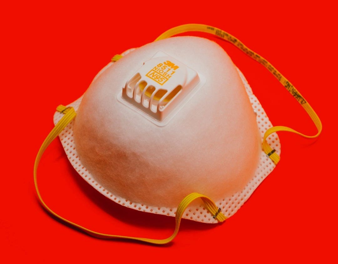 white and yellow leather sling bag