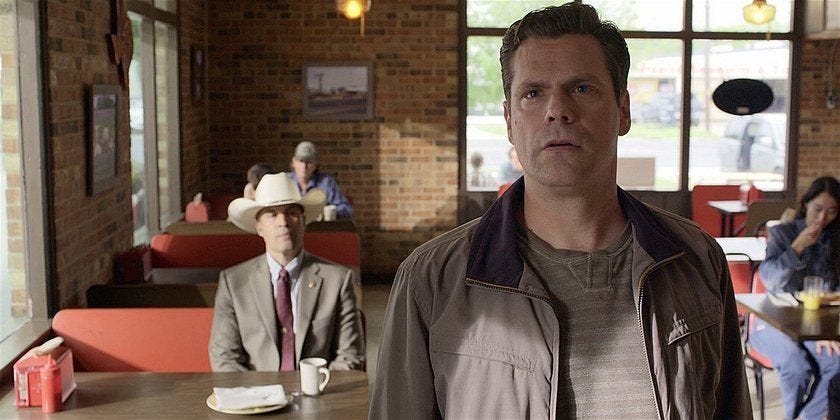 Walker Jesse Bush looking at tv news with police corruption story. Walker Jesse Bush looking at tv news with police corruption story.