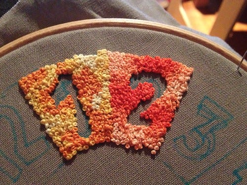 French knot clock face in progress French knot clock face in progress