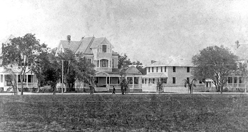 View of Avenue B, later renamed SE Second Avenue, from Royal Palm Park looking west, while it was entirely a residential quarter. Courtesy of Florida State Archives.