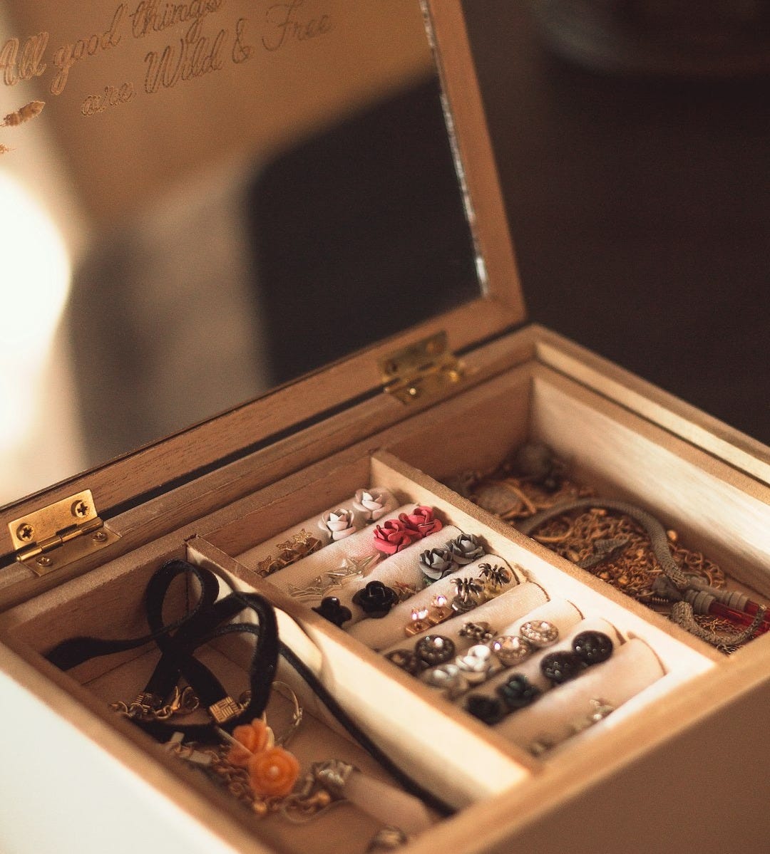 brown wooden chest box with gold and silver coins