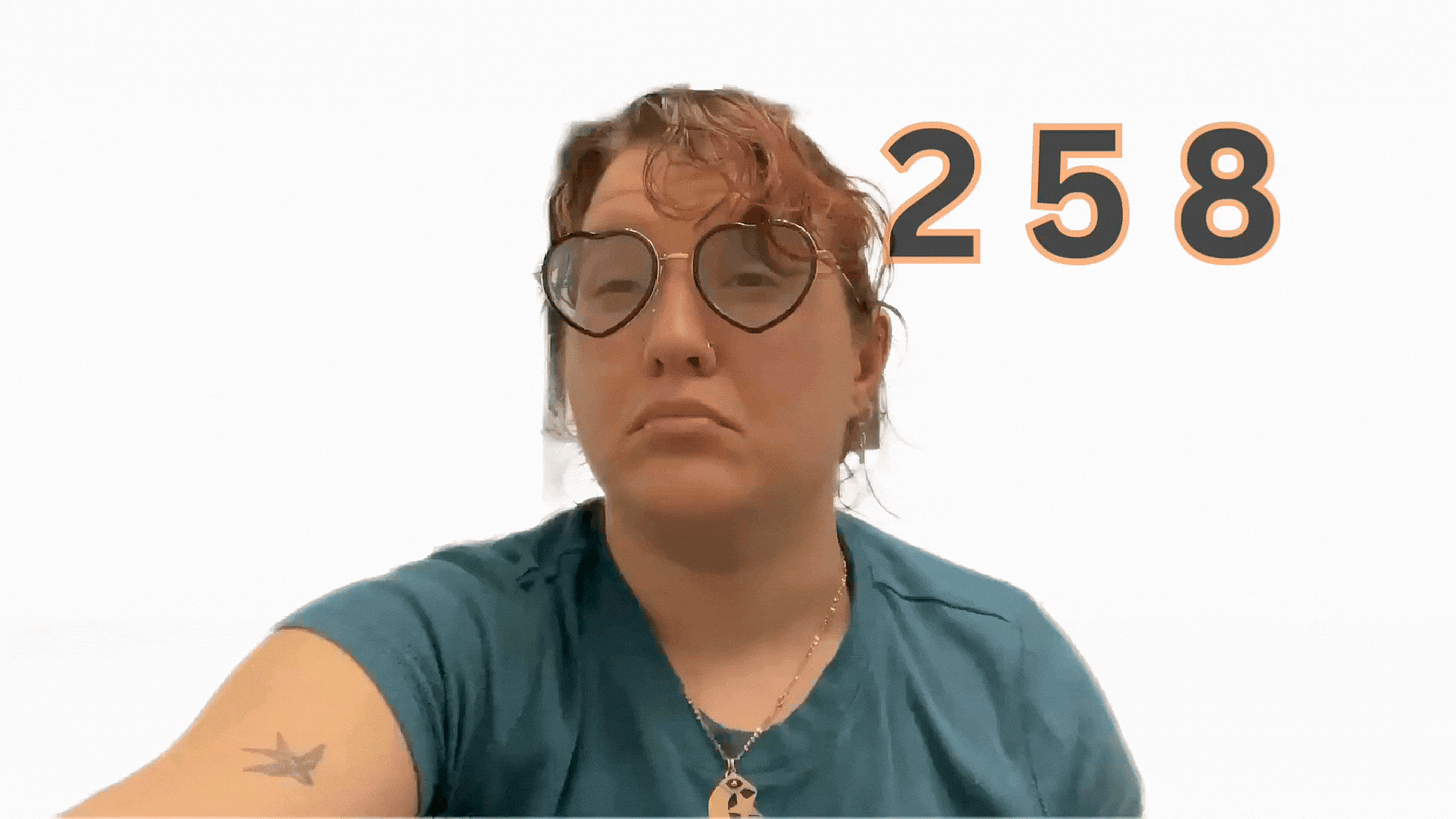 Carolyn signs "258" in American Sign Language. Carolyn signs "258" in American Sign Language.