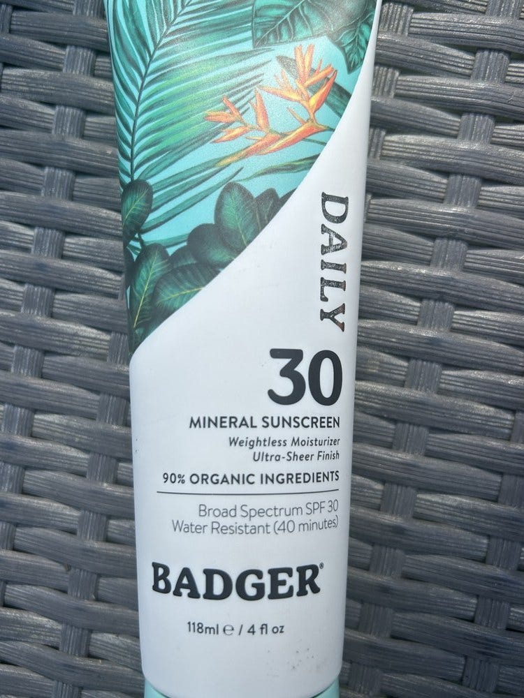 Close-up of a Badger Daily 30 sunscreen tube reading Mineral Sunscreen.