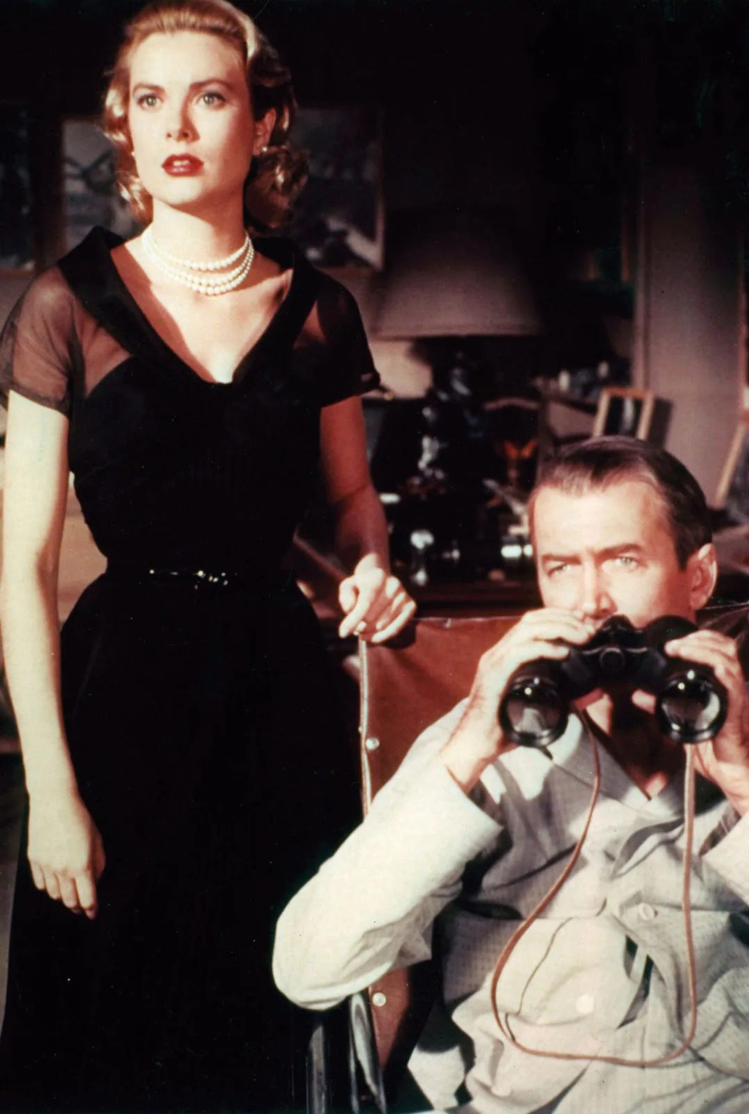Photo still of Grace Kelly and Jimmy Stewart from the film Rear Window