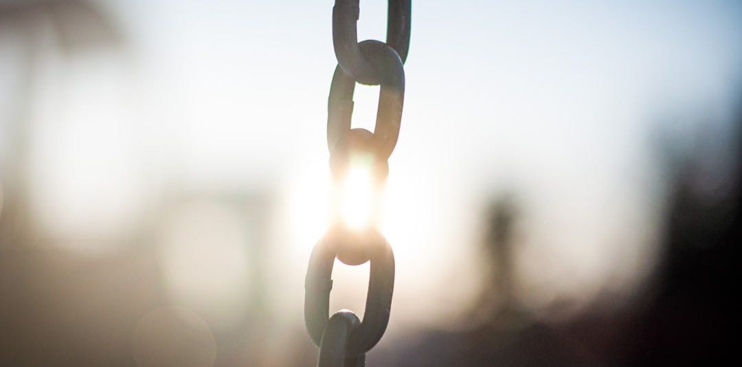 grey metal chain in close up photography
