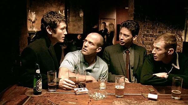 A group of men sitting at a table

AI-generated content may be incorrect.