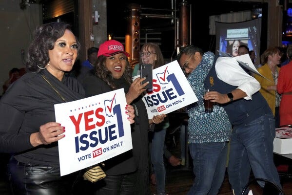 Hamilton County Commissioner Alicia Reece, second from left, joins voters in reacting to the passage of Ohio Issue 1, a ballot measure to amend the state constitution and establish a right to abortion, at an election night party hosted by the Hamilton County Democratic Party, Tuesday, Nov. 7, 2023, at Knox Joseph Distillery in the Over-the-Rhine neighborhood of Cincinnati. (Kareem Elgazzar/The Cincinnati Enquirer via AP) Hamilton County Commissioner Alicia Reece, second from left, joins voters in reacting to the passage of Ohio Issue 1, a ballot measure to amend the state constitution and establish a right to abortion, at an election night party hosted by the Hamilton County Democratic Party, Tuesday, Nov. 7, 2023, at Knox Joseph Distillery in the Over-the-Rhine neighborhood of Cincinnati. (Kareem Elgazzar/The Cincinnati Enquirer via AP)