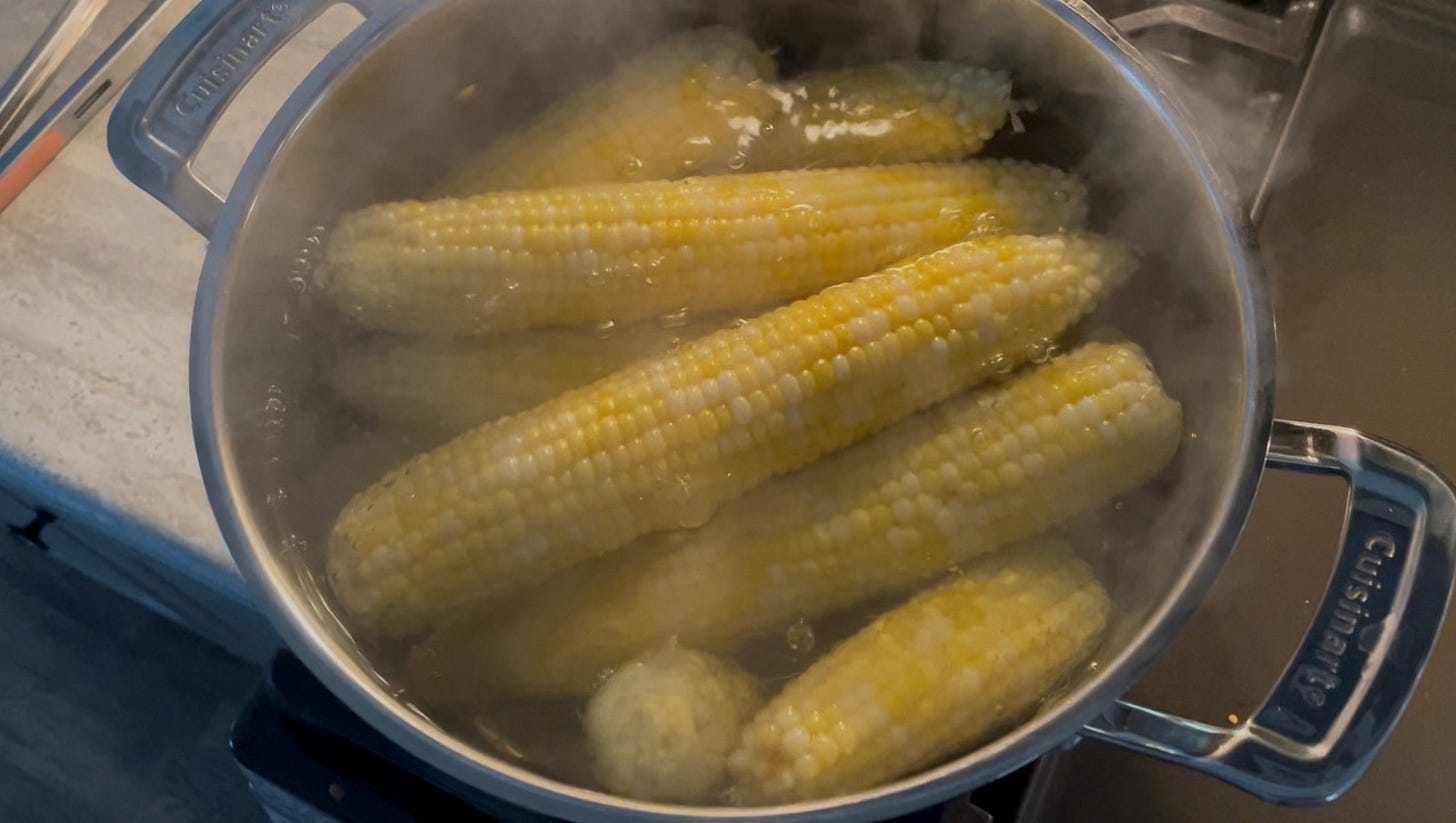 A pot of sweet corn on the cob boiling on the stove in Dr. Dave's kitchen
