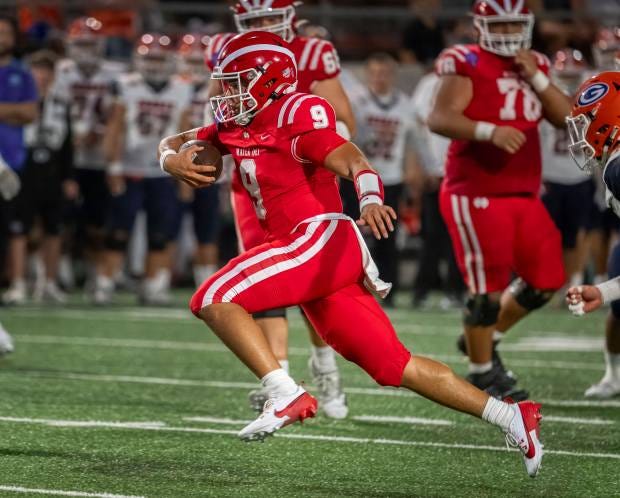 Mater Dei quarterback Dash Beierly finds some running room against...