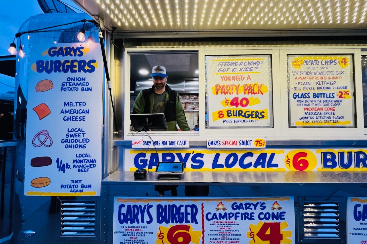 man in colorful burger truck