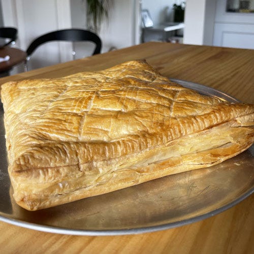 Ham and cheese pie being eaten.