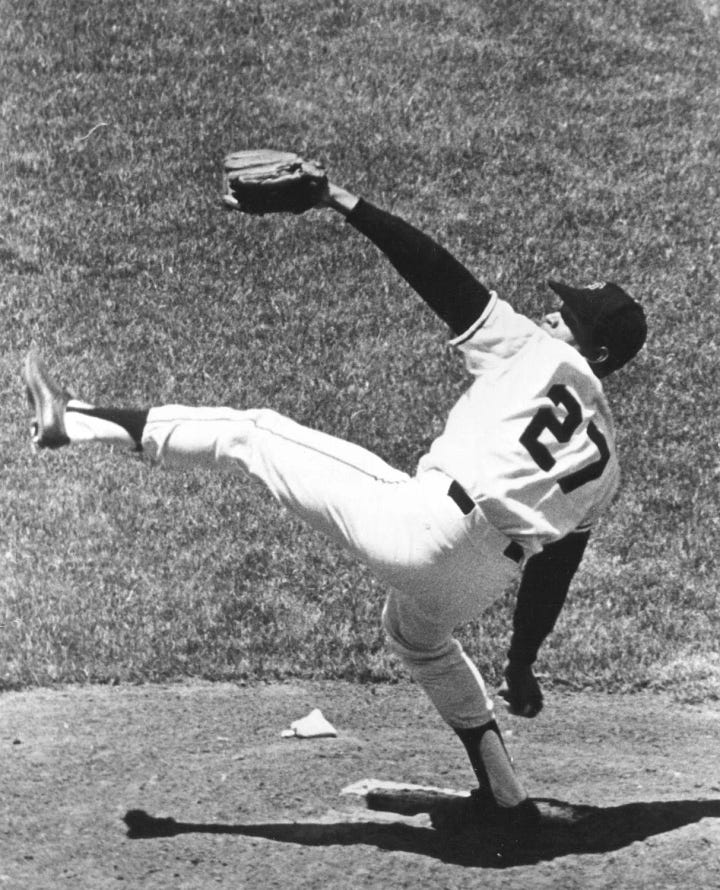 Warren Spahn and Juan Marichal with their high-kick deliveries.